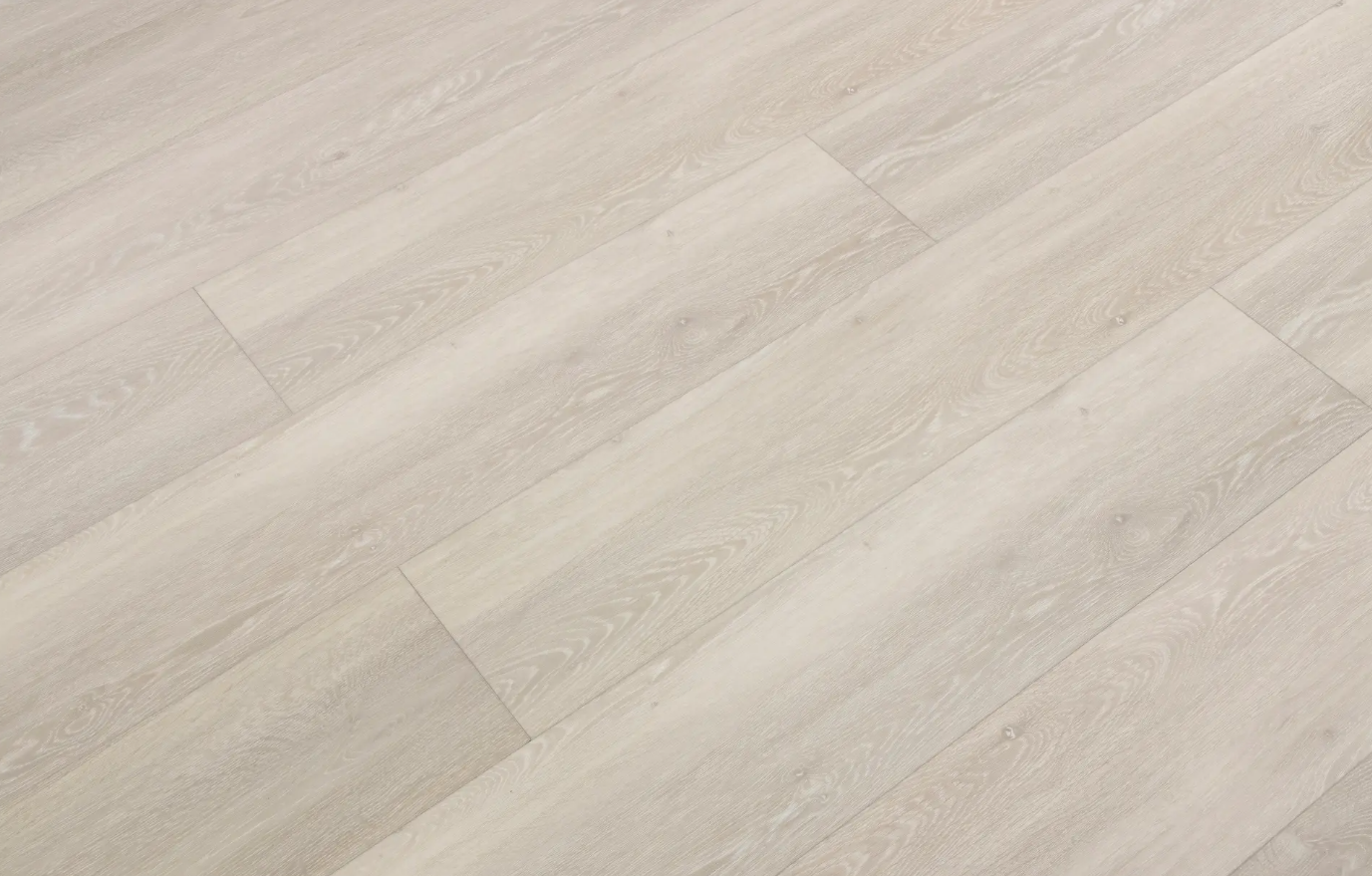 A close up of a white tile floor.