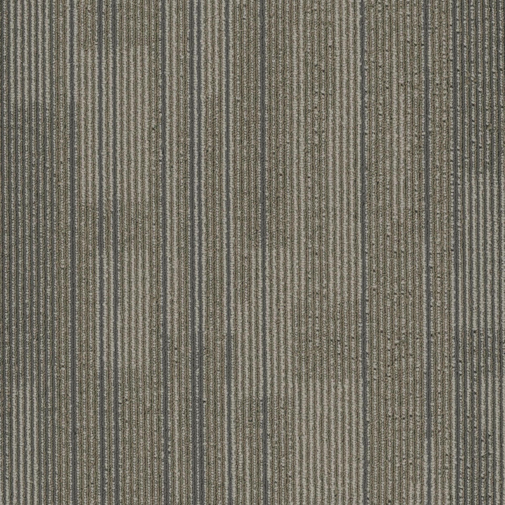 A close up of a carpet with a striped pattern.