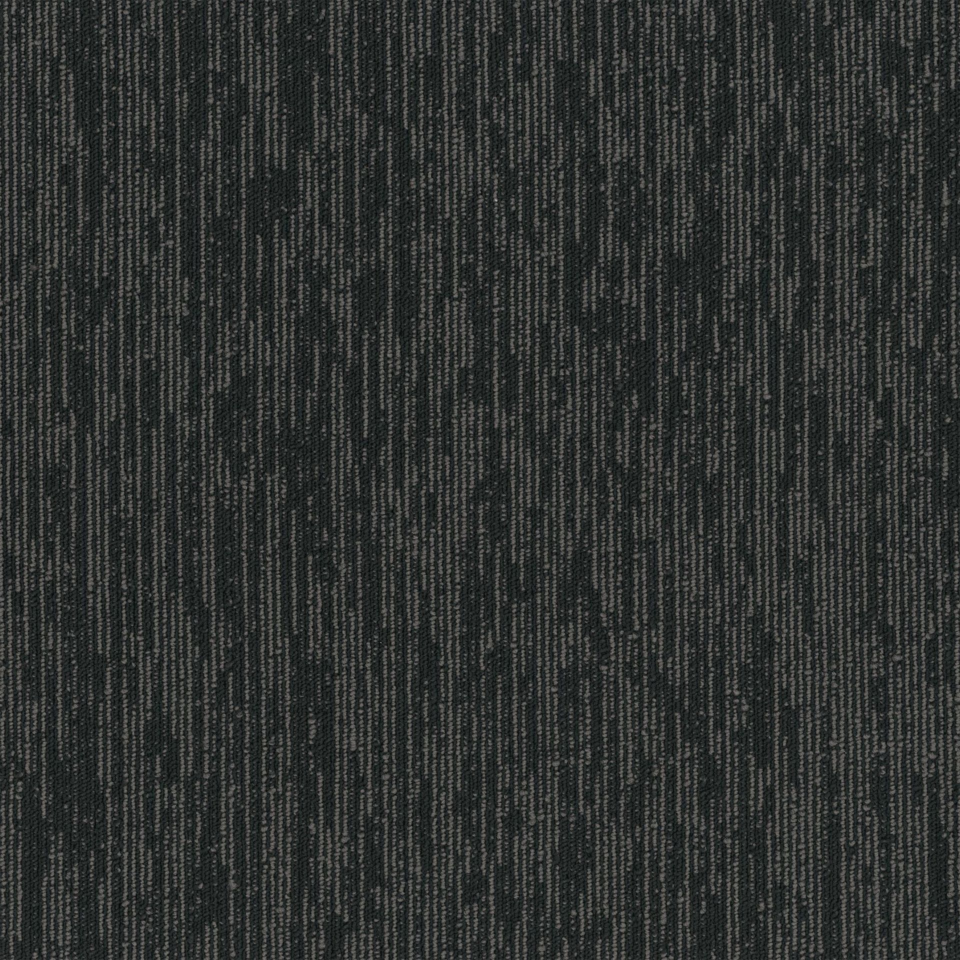 A close up of a black carpet with a striped pattern.