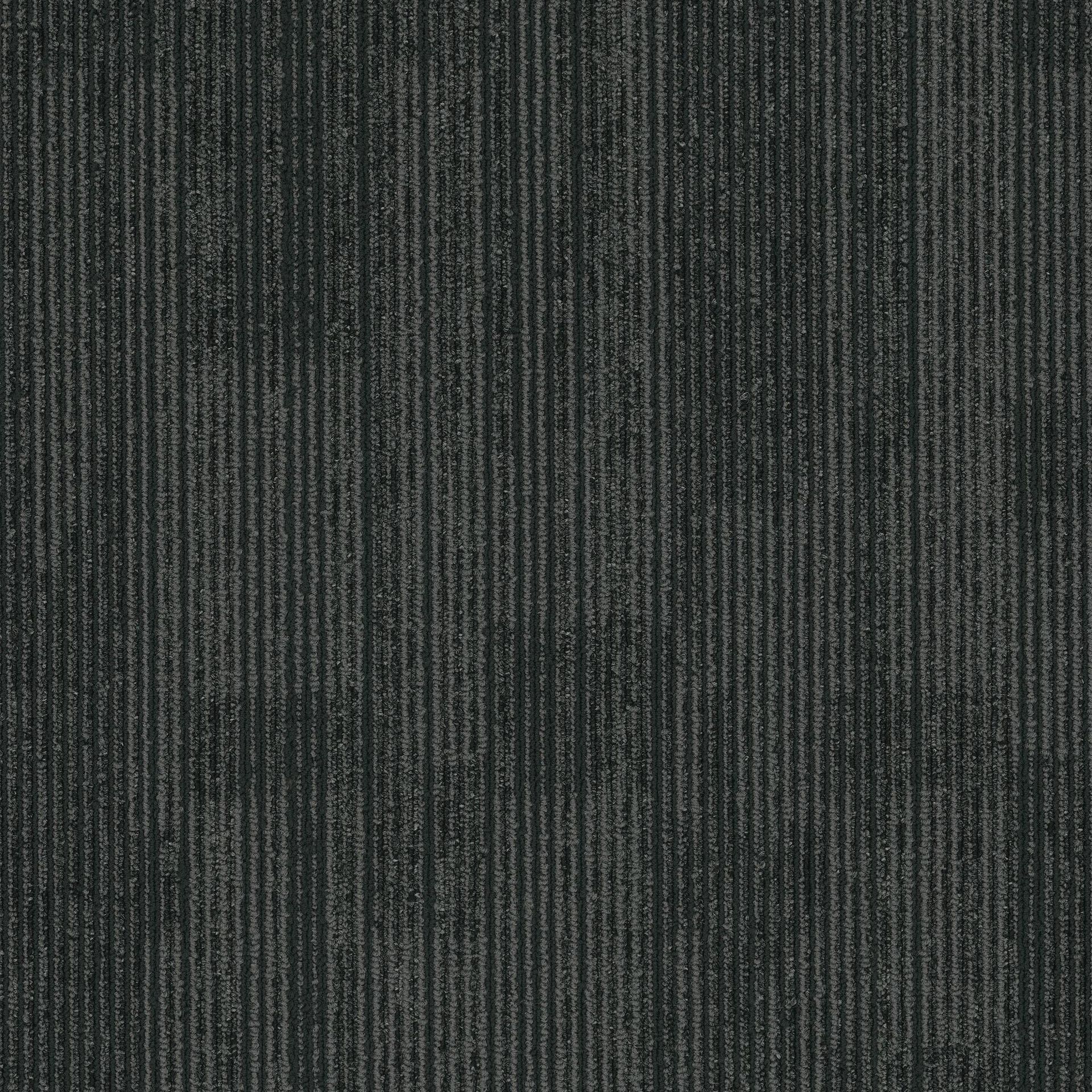 A close up of a black carpet with a striped pattern.