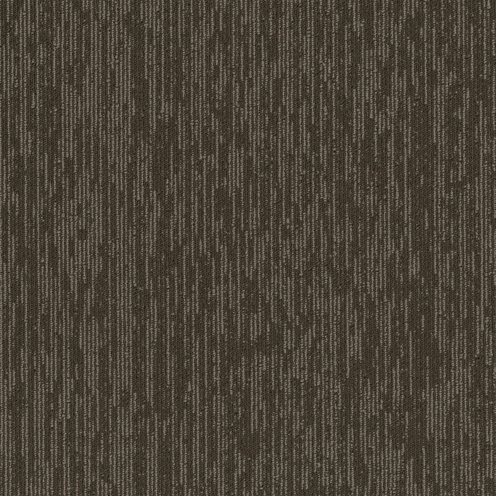 A close up of a brown carpet with a striped pattern.