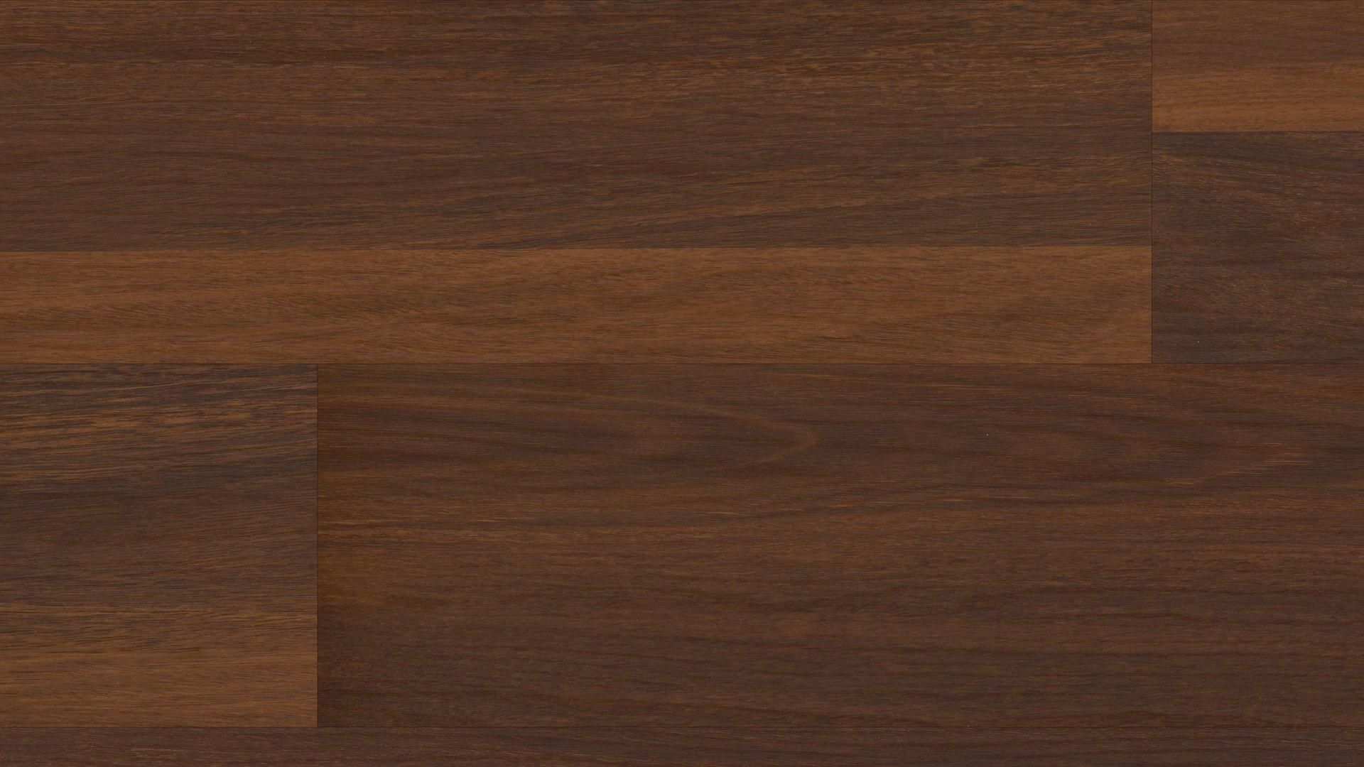 A close up of a dark brown wooden floor.