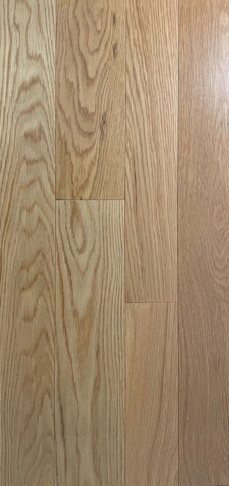 A close up of a wooden floor with a grain pattern.