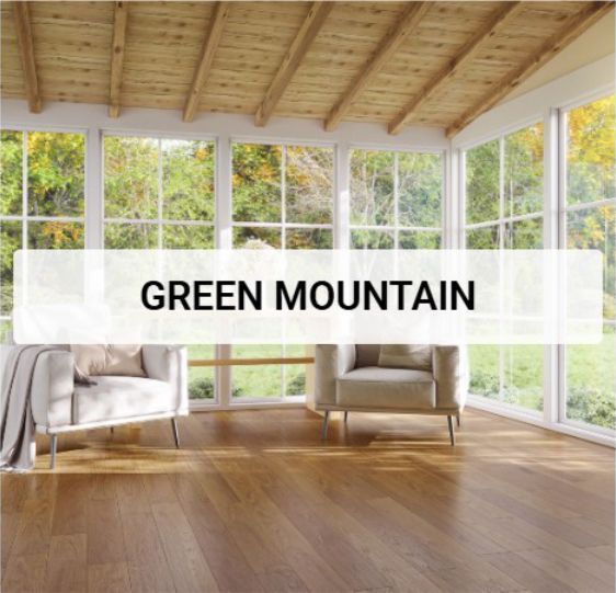 A living room with a lot of windows and the word Green Mountain.