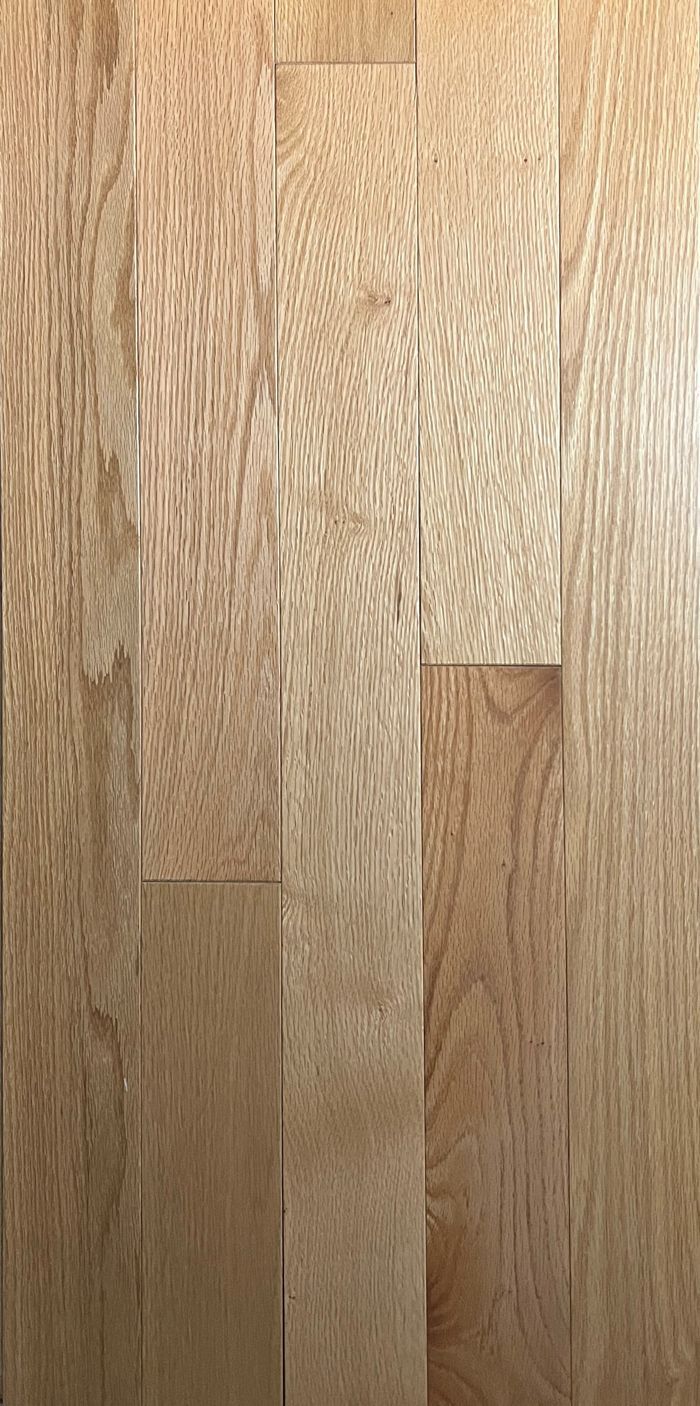 A close up of a wooden floor with a grain pattern.