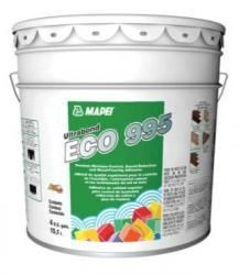 A bucket of white paint with a green label on it.