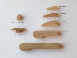 A bunch of wooden pieces are sitting on top of each other on a table.