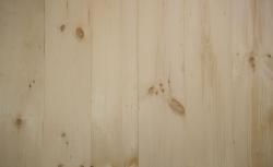 A close up of a piece of wood with a grainy texture.