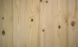 A close up of a piece of wood with holes in it.