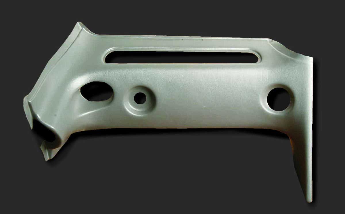 A piece of metal with holes in it on a black background