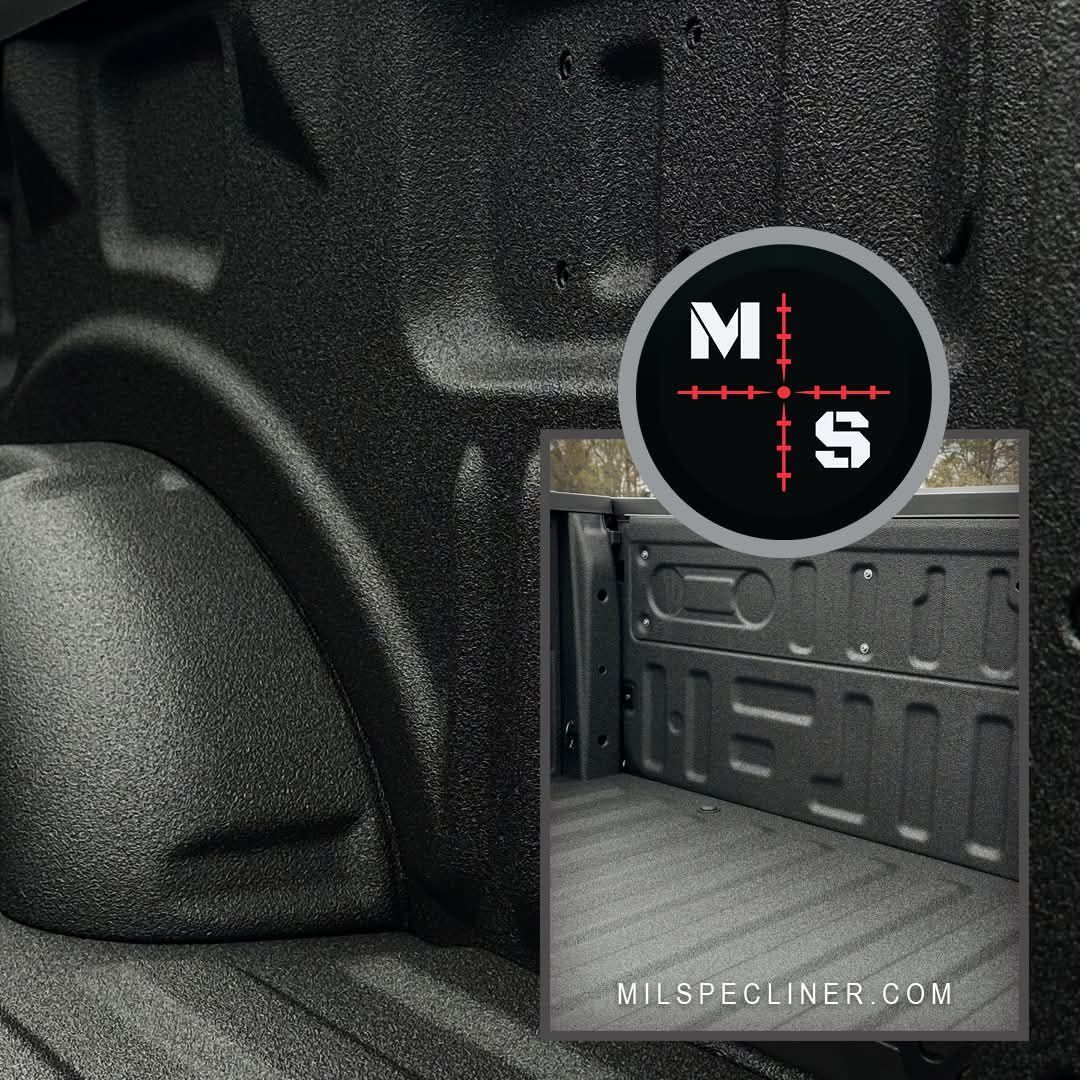 Black truck bed interior with textured liner; a circular graphic 