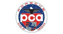 The logo for the porsche club of america has an eagle on it.