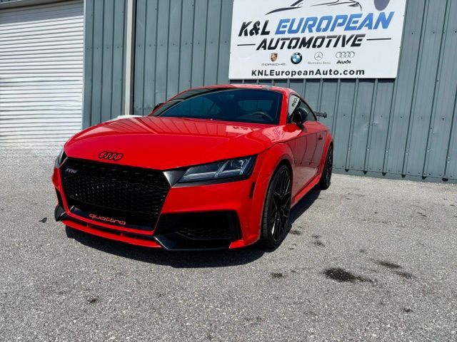 Red Audi sports sedan parked outside K&L European Automotive dealership