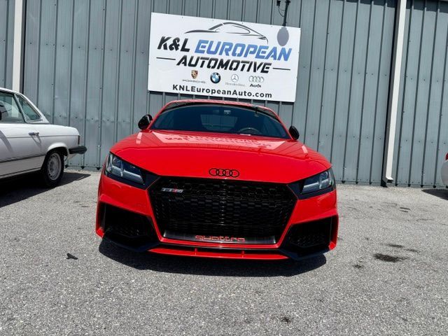 Red Audi parked outside K&L European Automotive shop