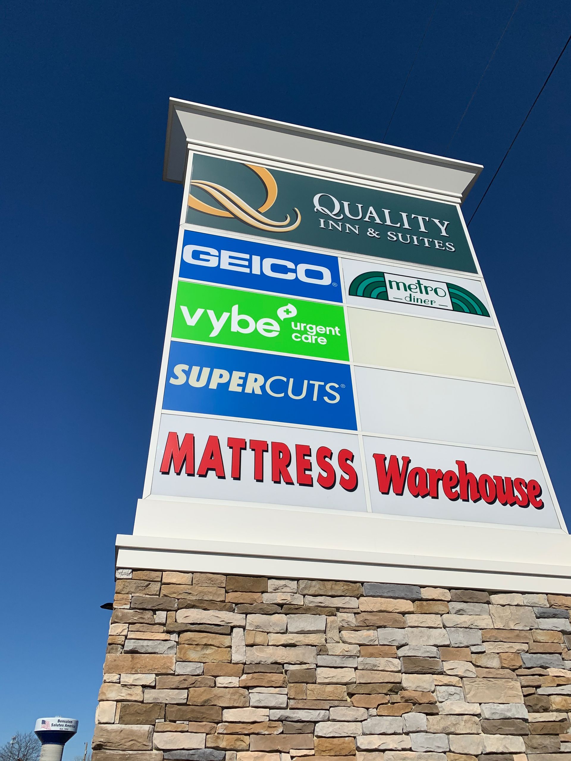 A free-standing with many business signs