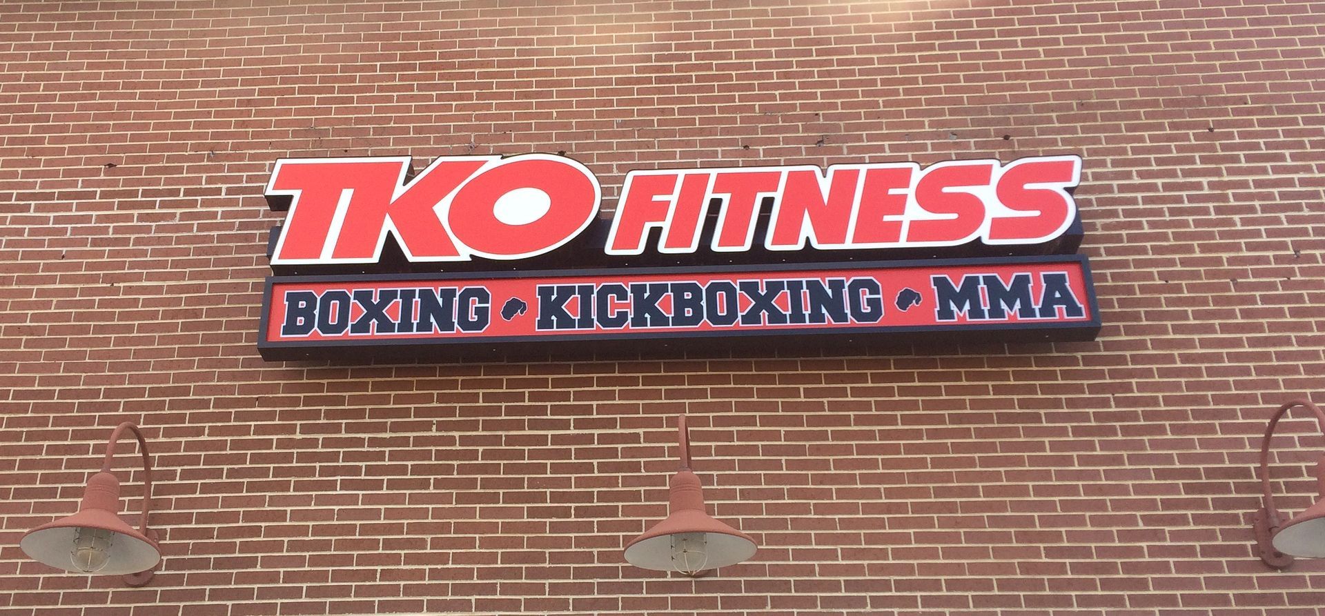 A sign for tko fitness boxing kickboxing and mma