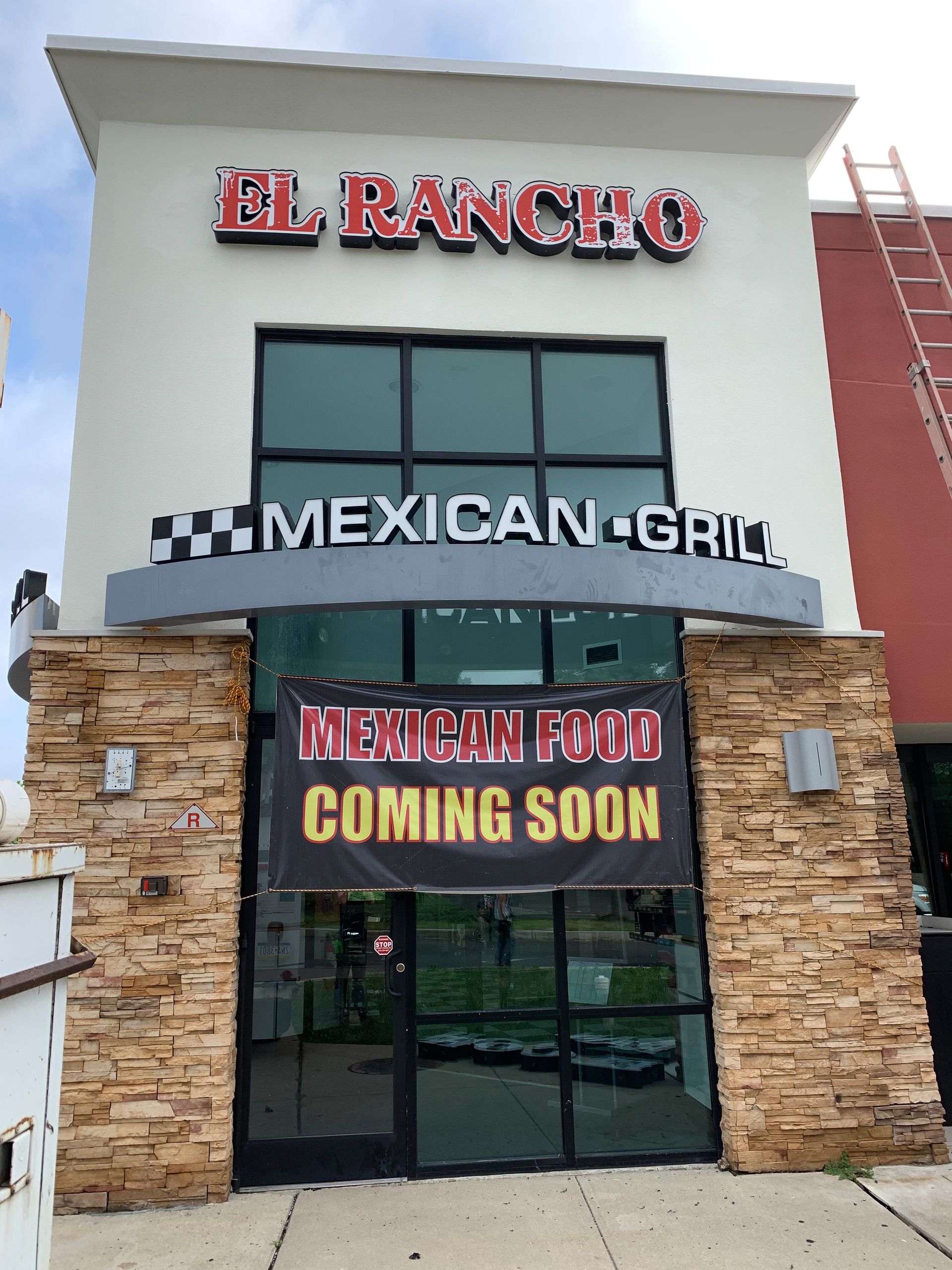 A sign that says El Rancho Mexican Grill.