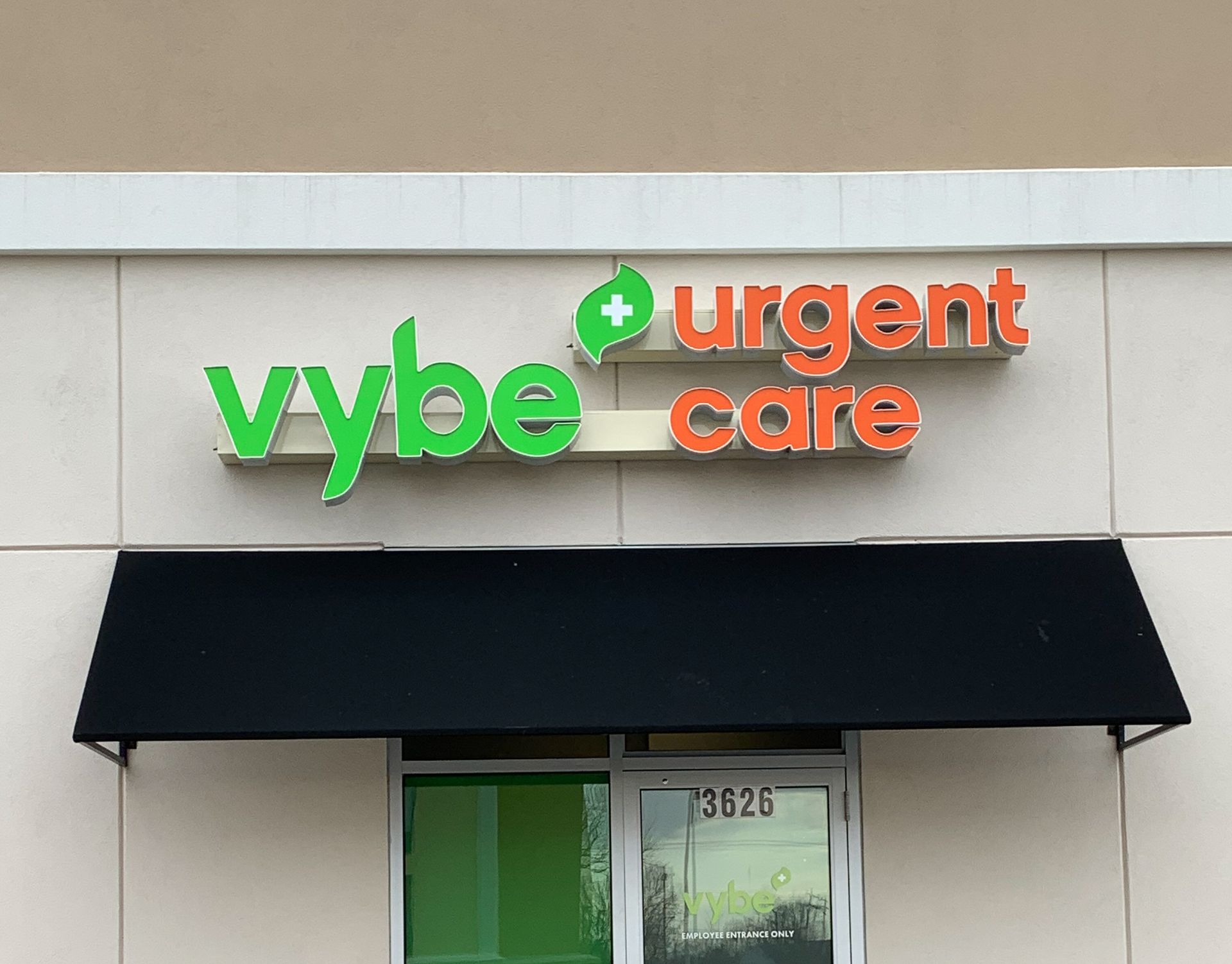 A sign that says Vybe Urgent Care.