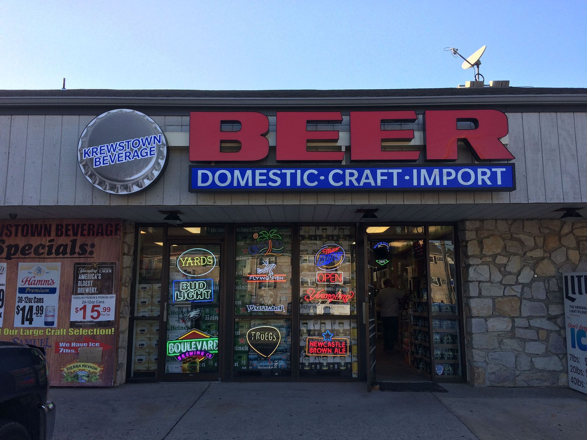 A store with a large sign that reads Beer Domestic Craft Import.