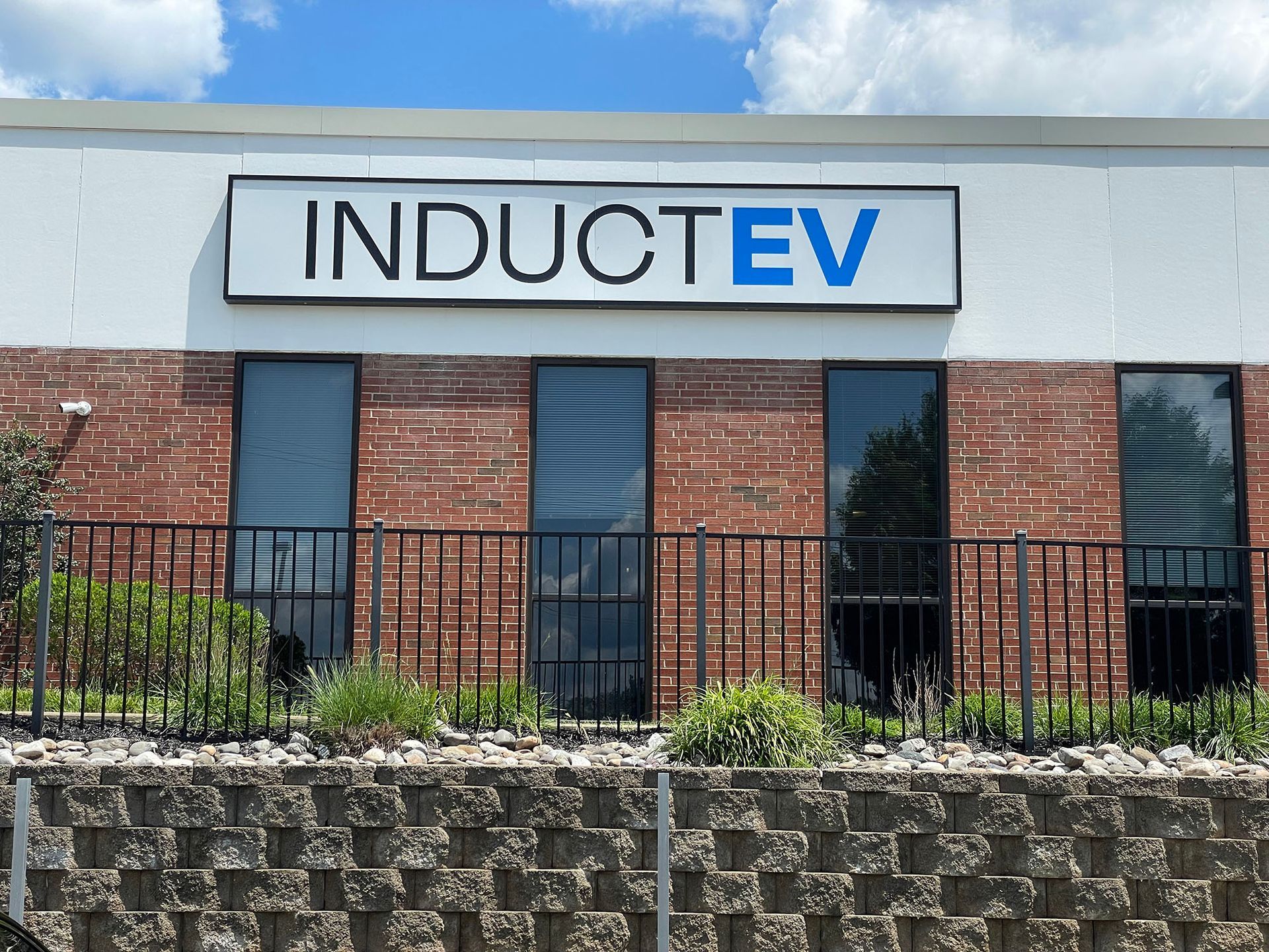 A box sign that reads Induct EV.