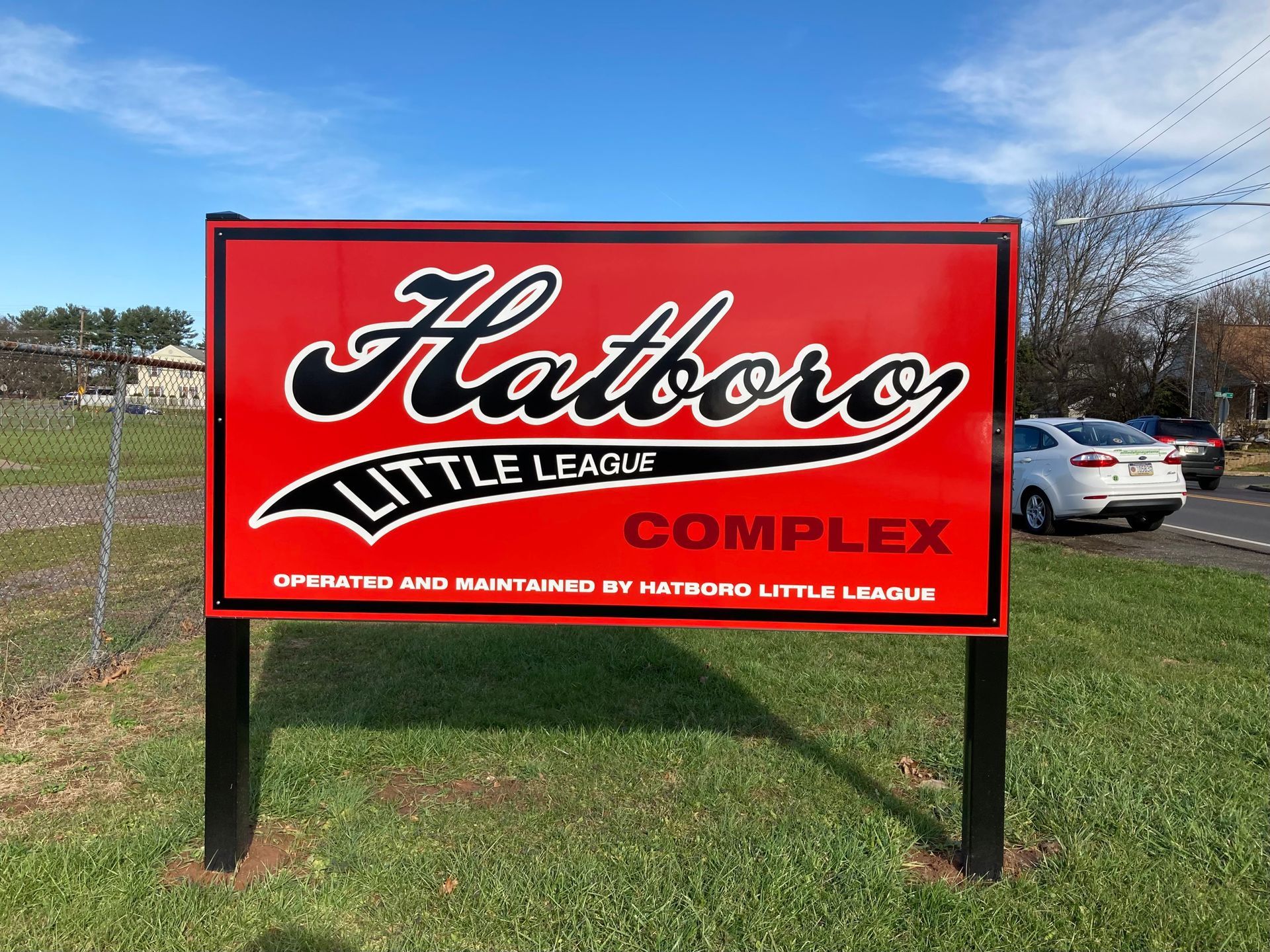 A red sign for the hatboro little league complex