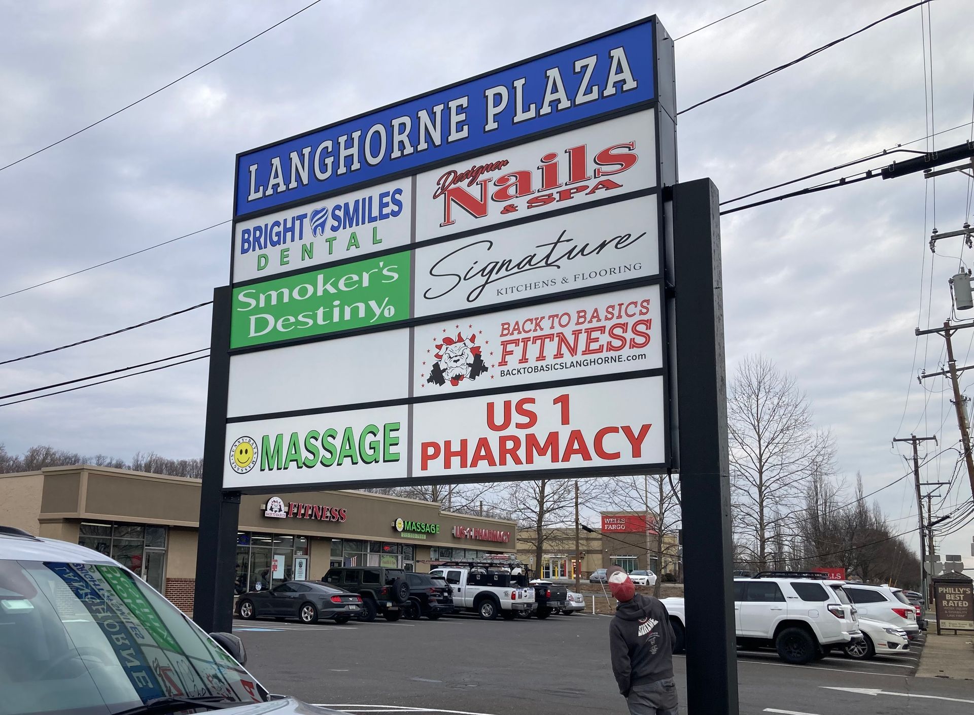 A truck is parked in front of a revolution laundromat.