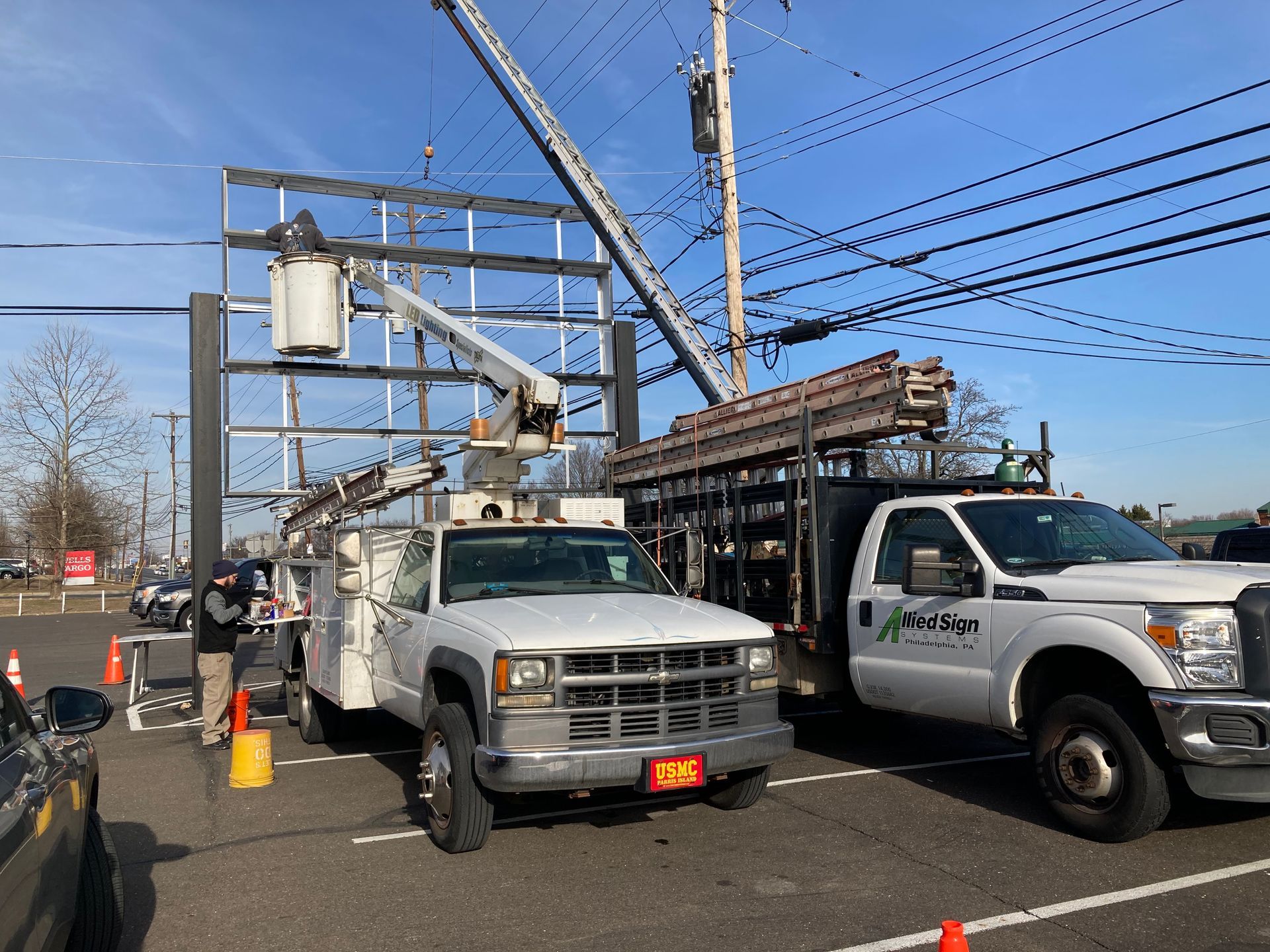 Two trucks are parked next to each other in a parking lot.