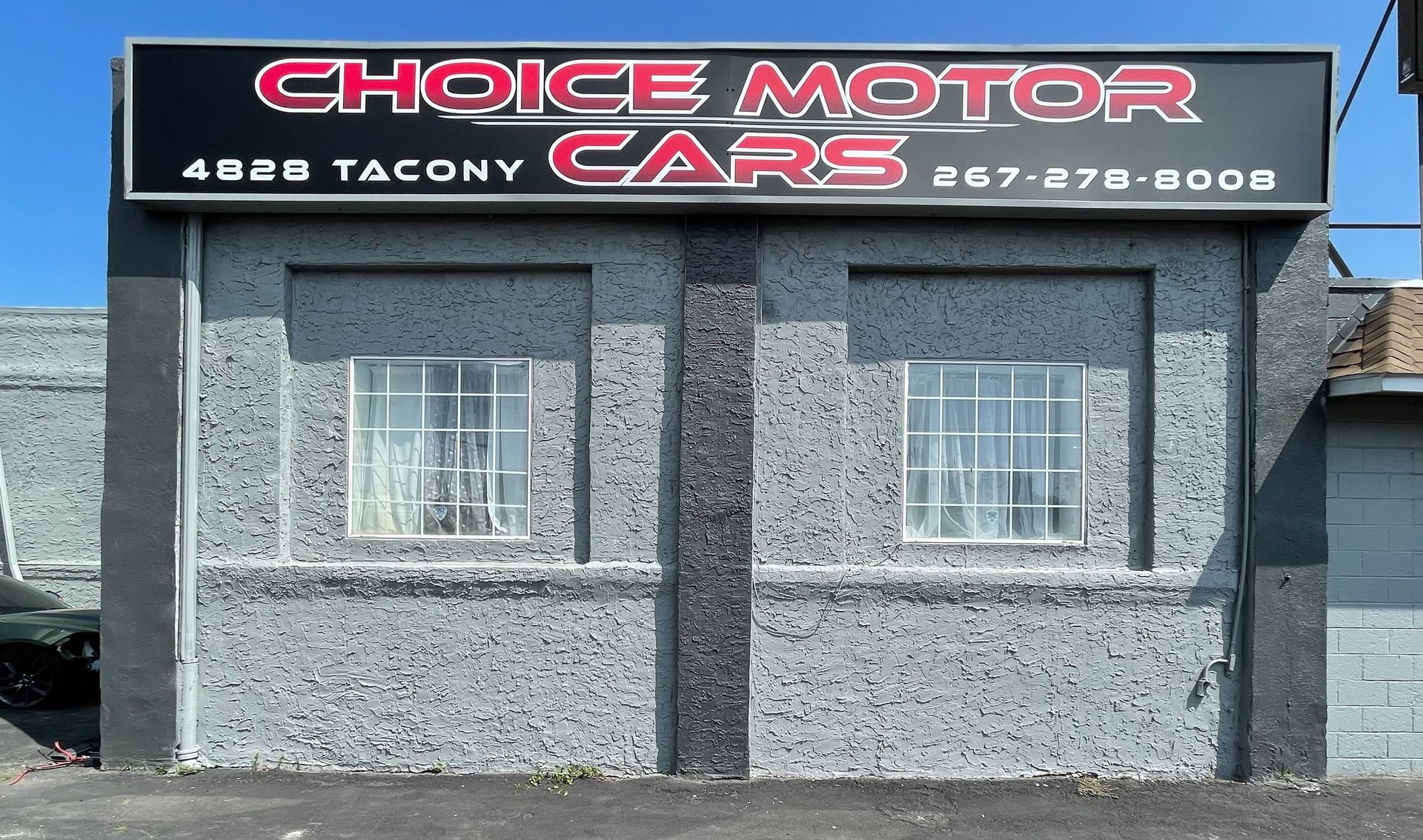 A building with a sign that says choice motor cars