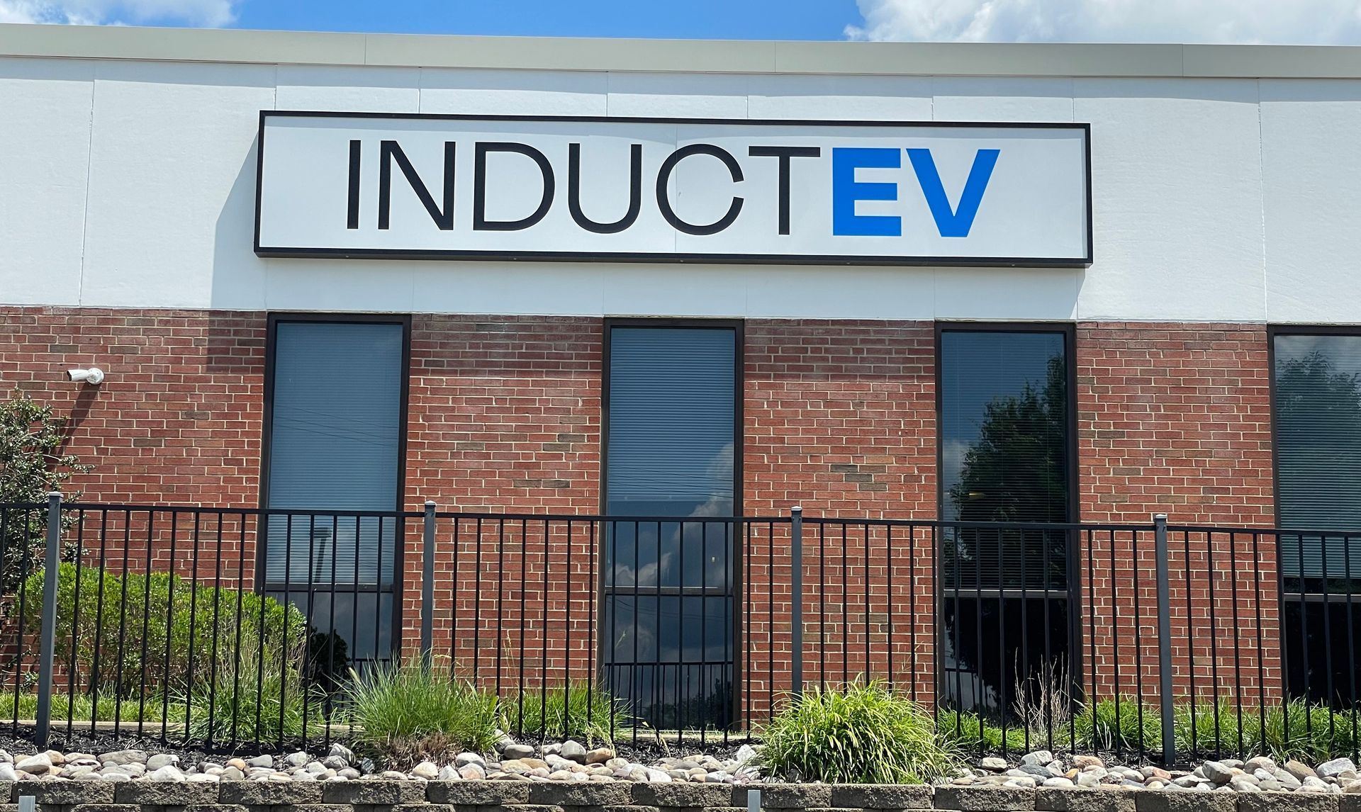 A brick building with a sign that says inductev on it