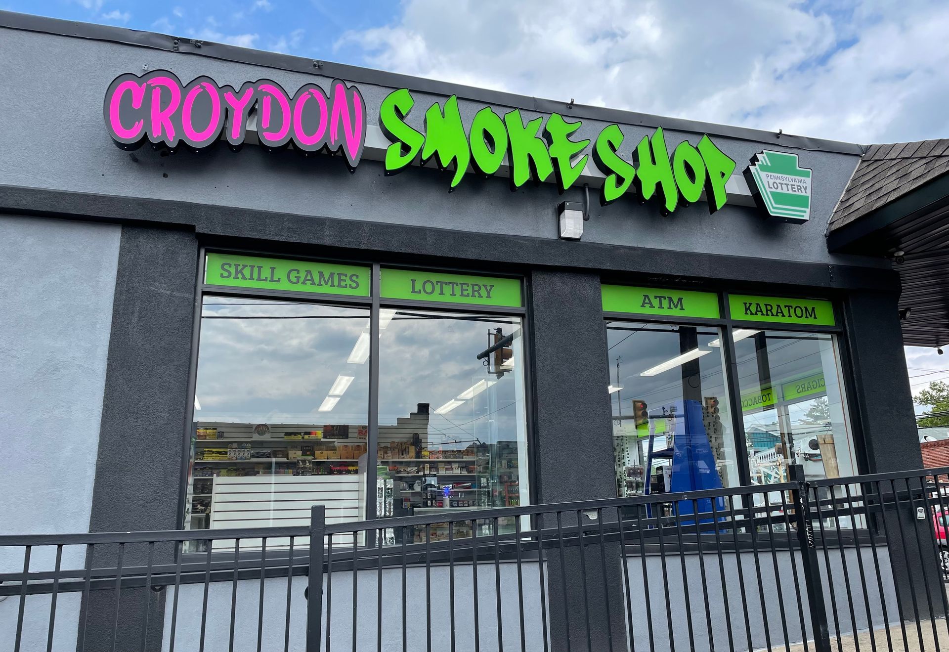 A store front with a sign that says croydon smoke shop