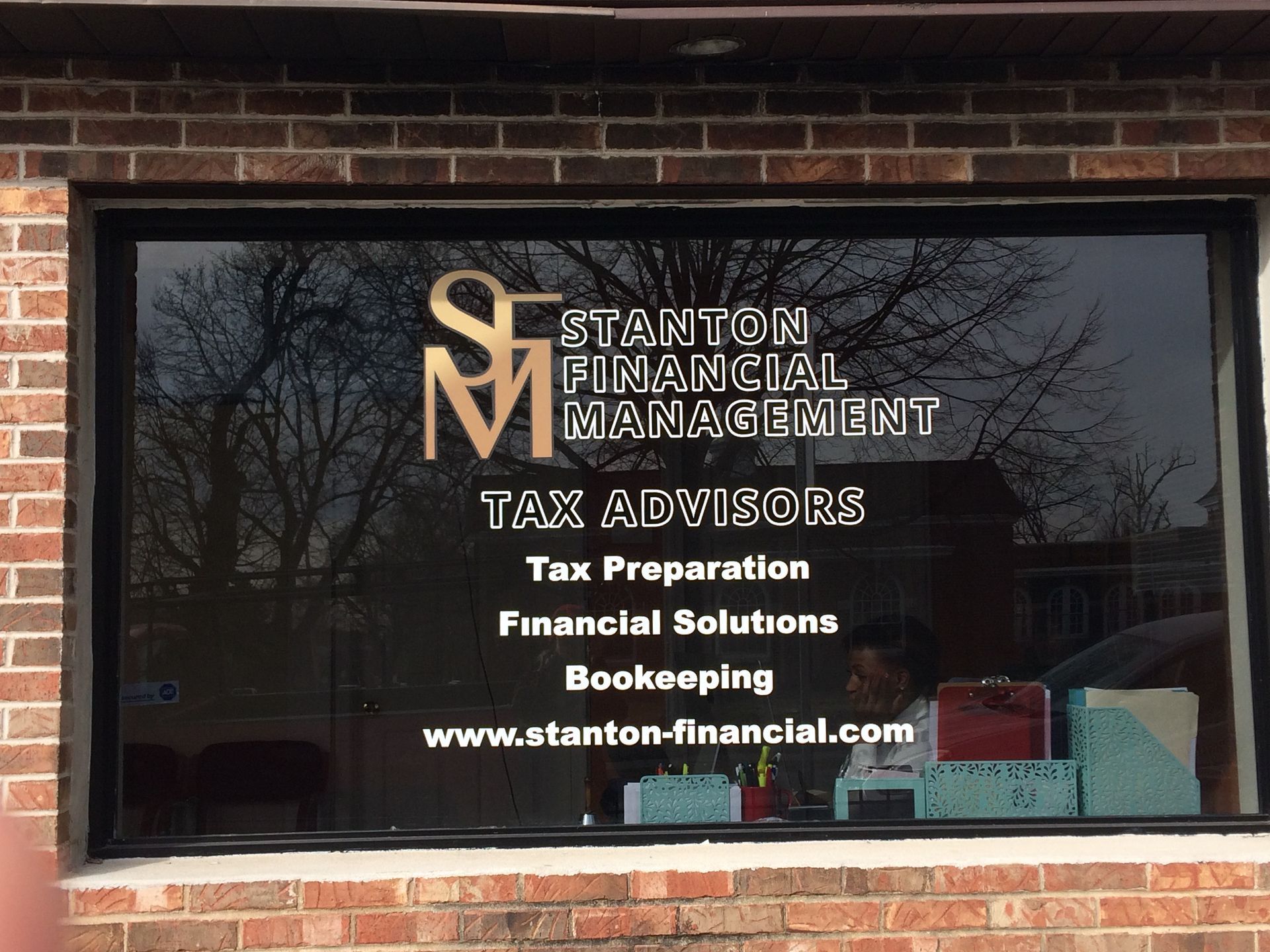 A window that says stanton financial management on it