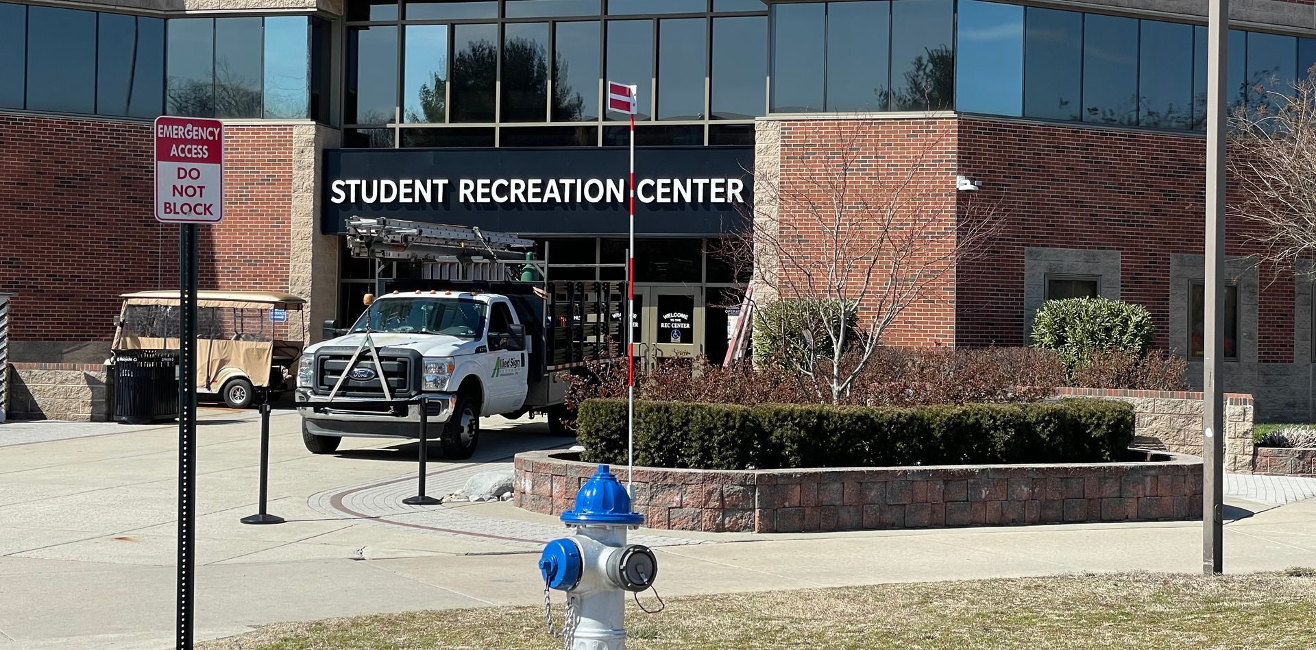 A fire hydrant is in front of a student recreation center.