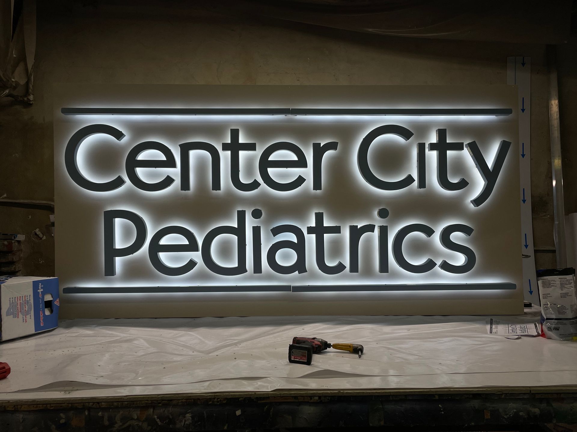 A sign that says center city pediatrics on it