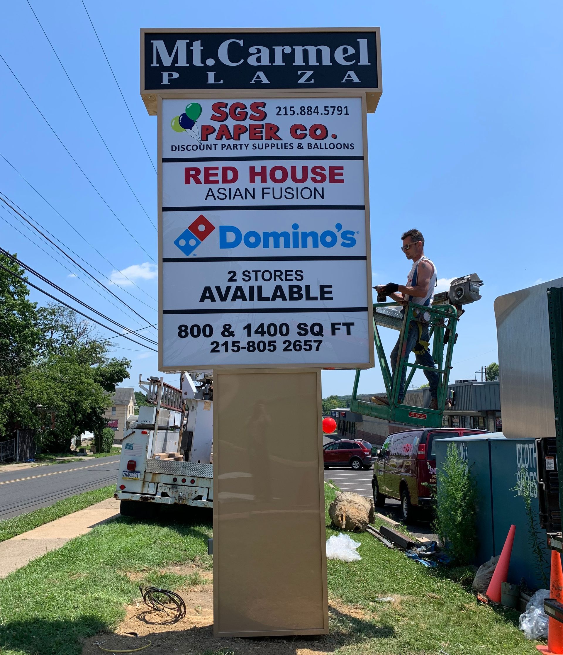A sign for mt. carmel plaza is being installed