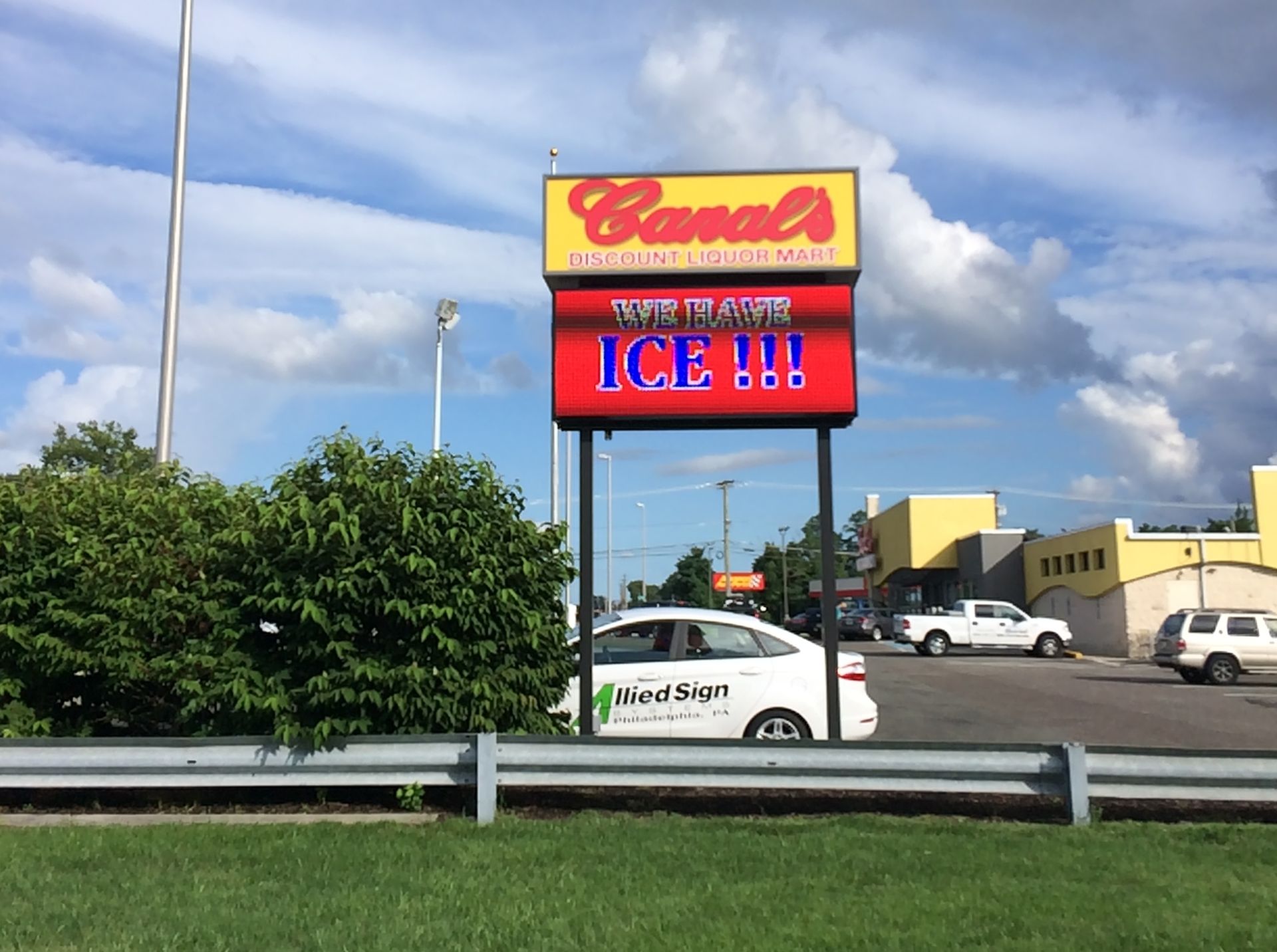 A car is parked in front of a sign that says canal 's