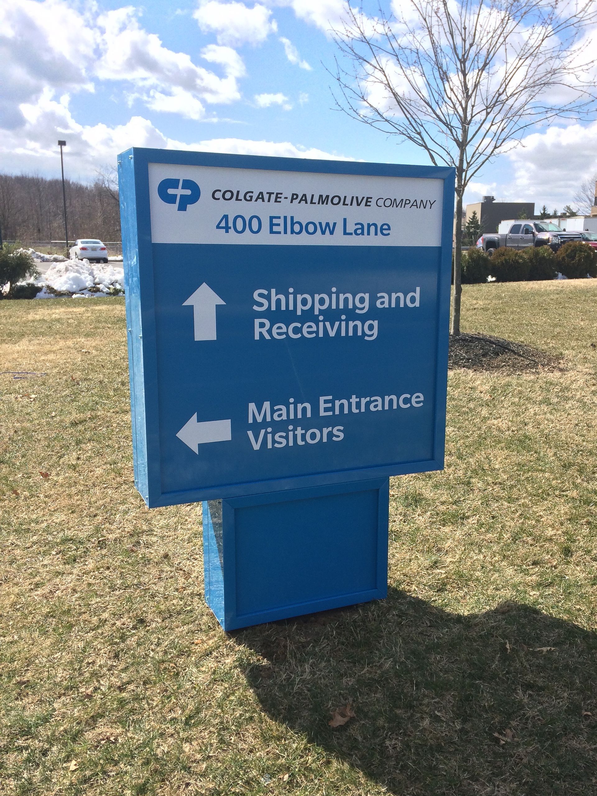 A blue sign that says shipping and receiving on it