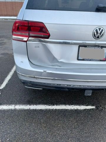 Volkswagen Silver SUV rear damage