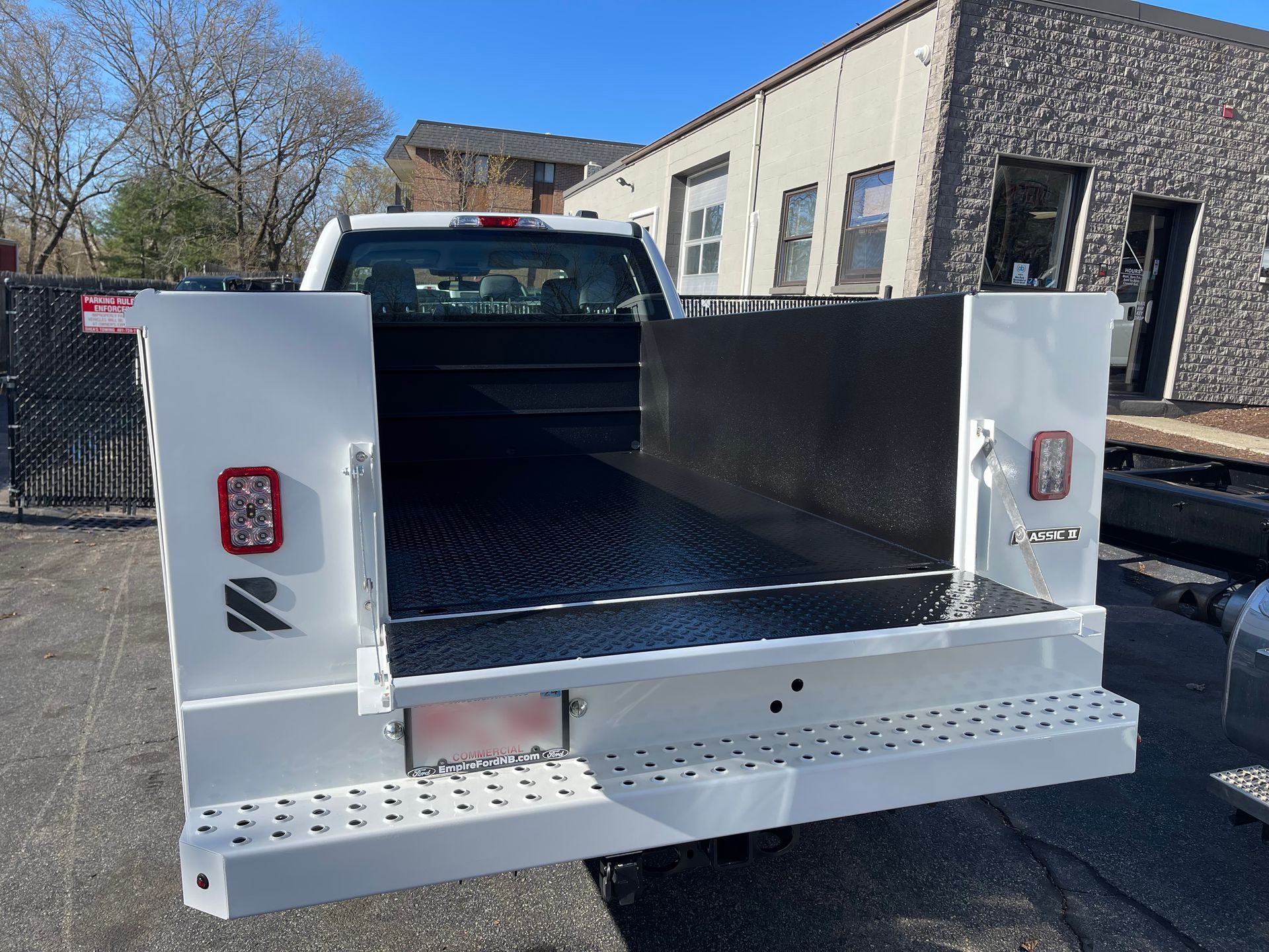 A white truck with a black bed