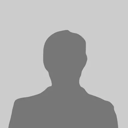 A silhouette of a man without a face on a gray background.