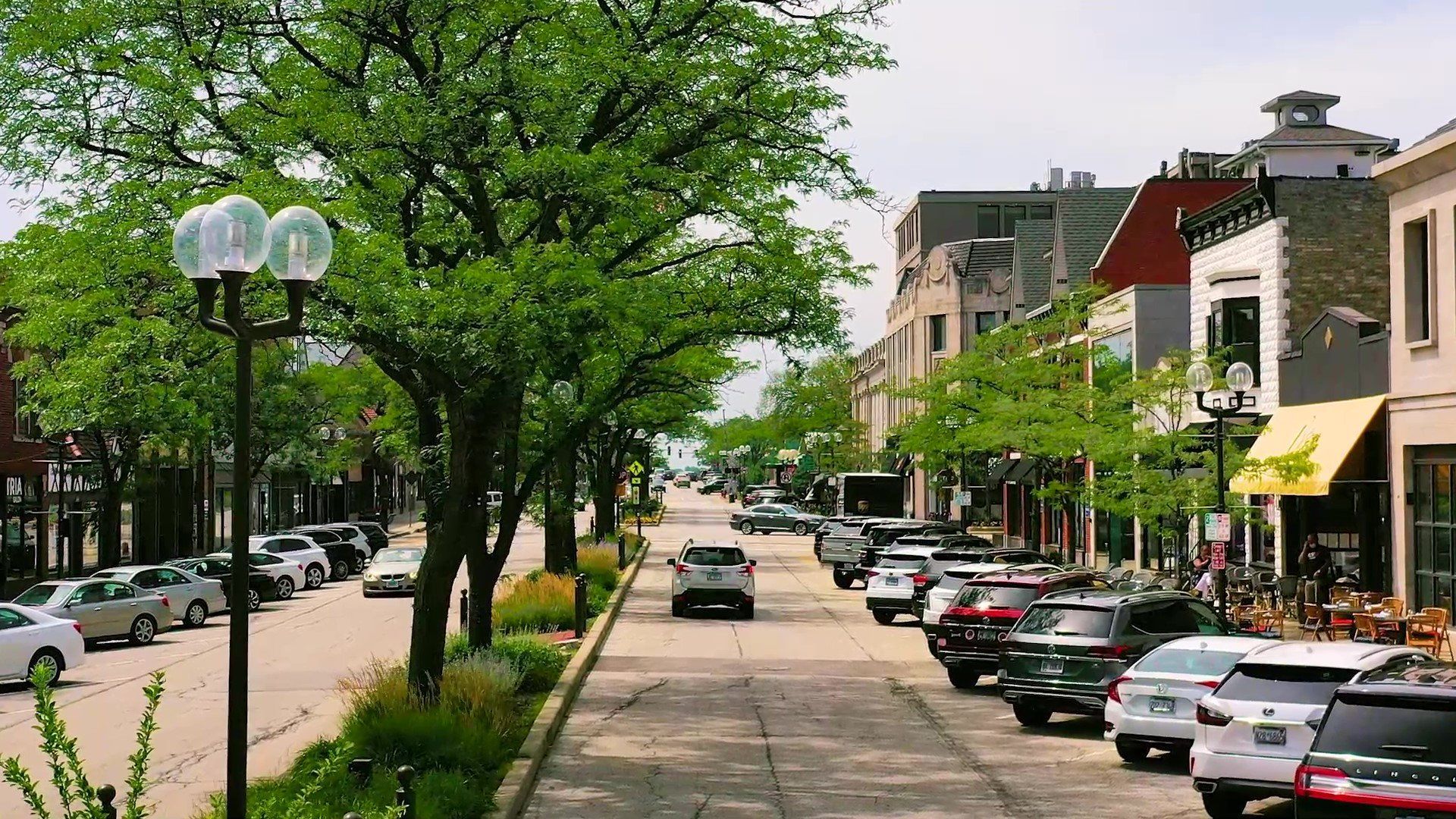 street view with houses and trees of highland park, il