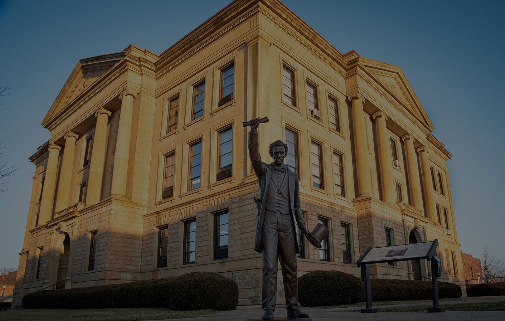 statue of abraham lincoln in front of logan county courthouse in lincoln, il