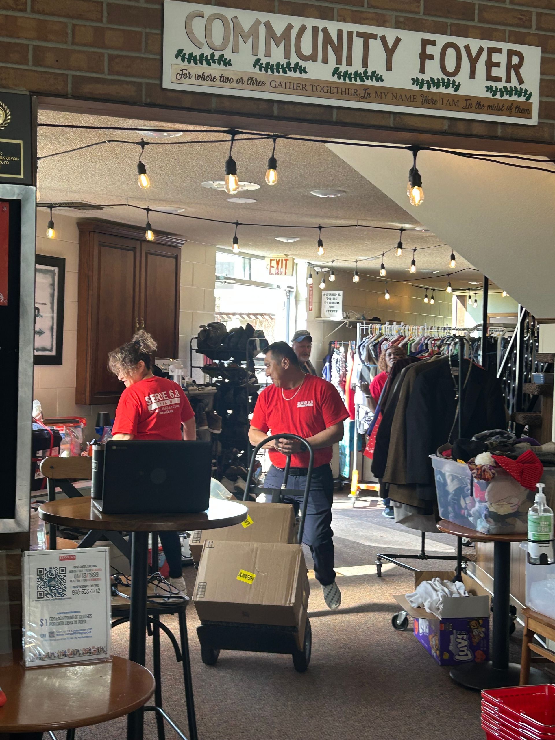 A group of people are working in a community foyer