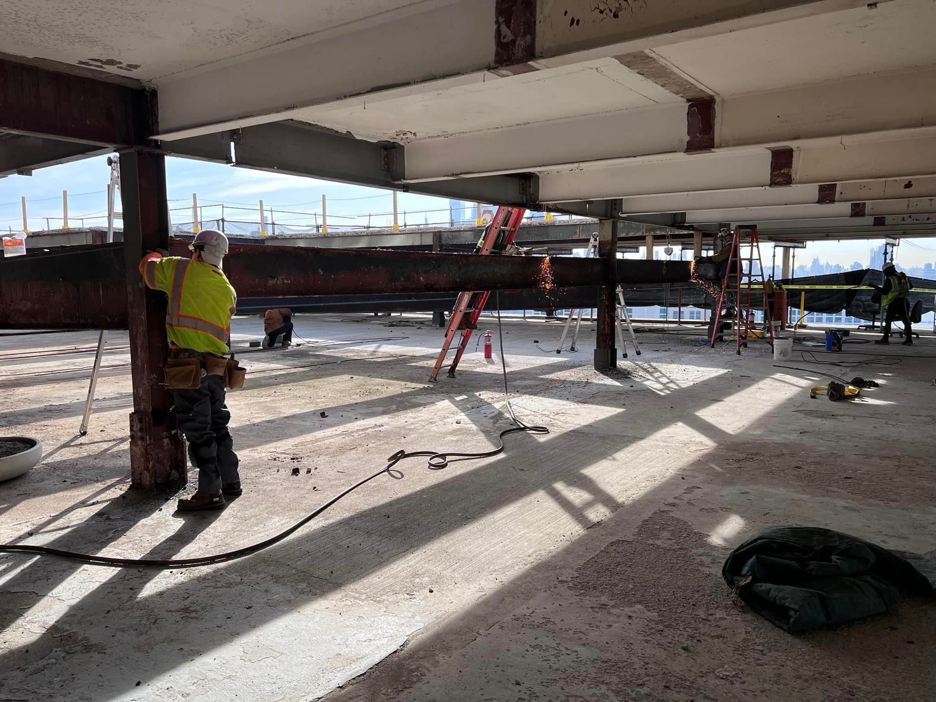 A group of construction workers are working on a building under construction.