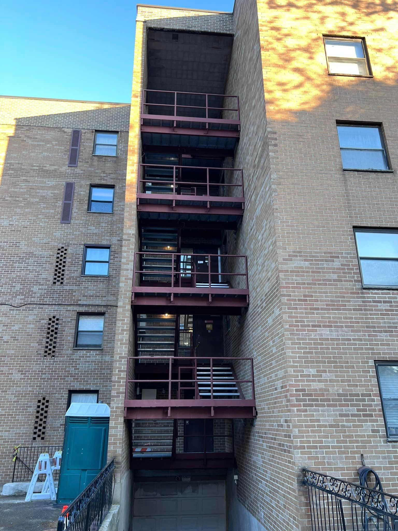 A brick building with a fire escape on the side