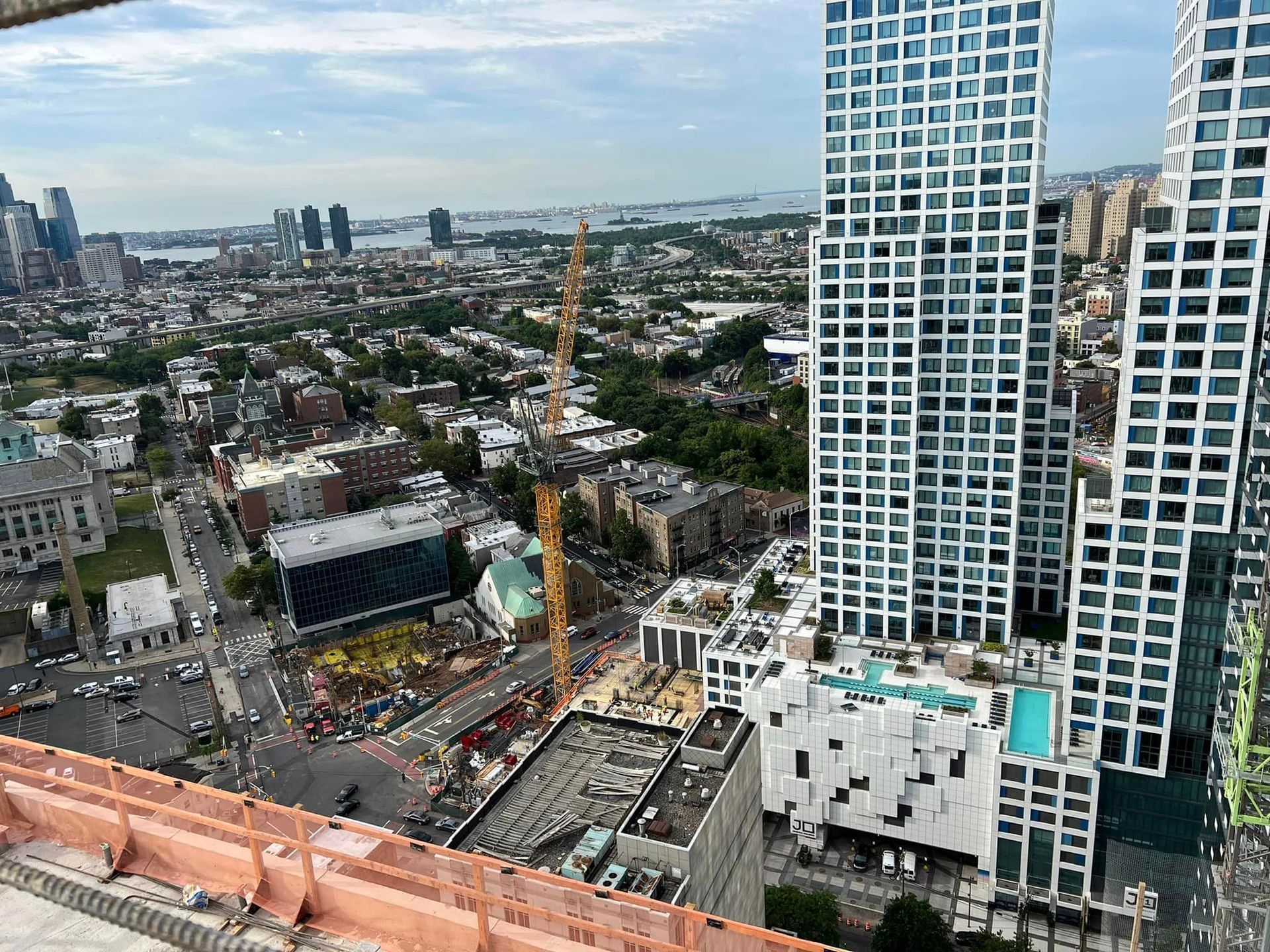 An aerial view of a city with a lot of tall buildings.
