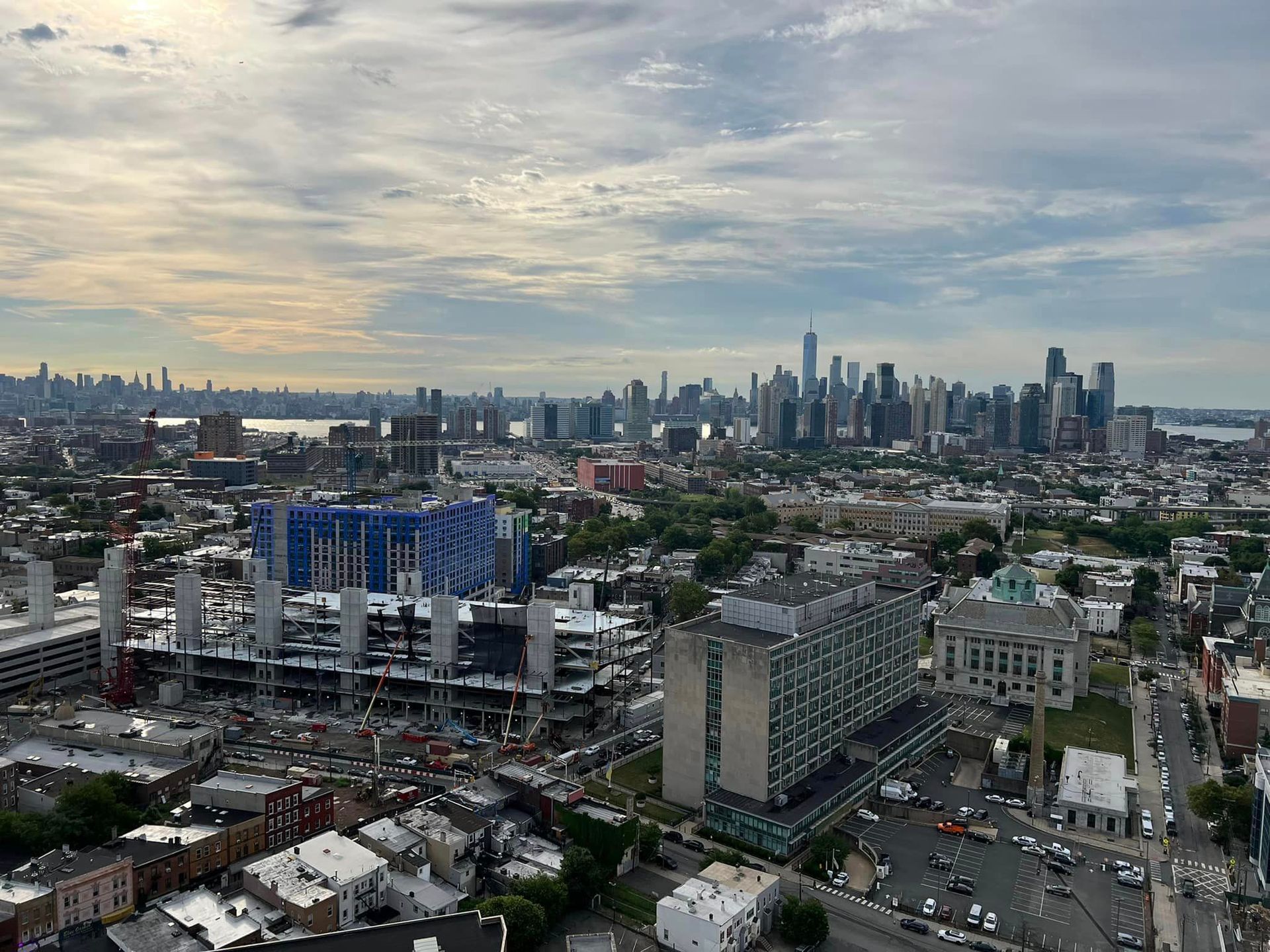 An aerial view of a city with a skyline in the background.