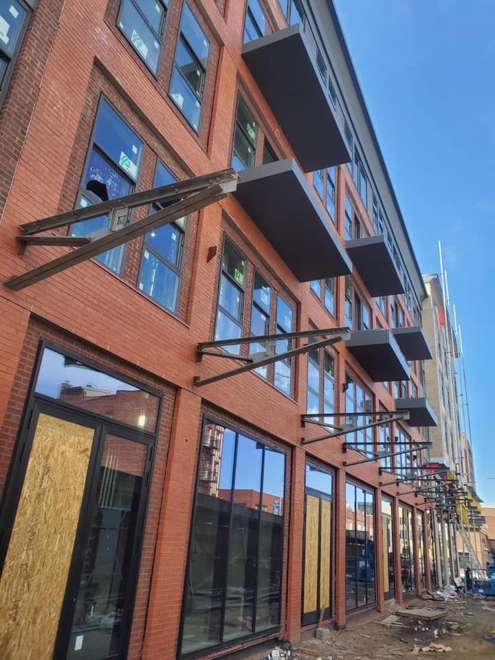 A brick building with a lot of windows and balconies
