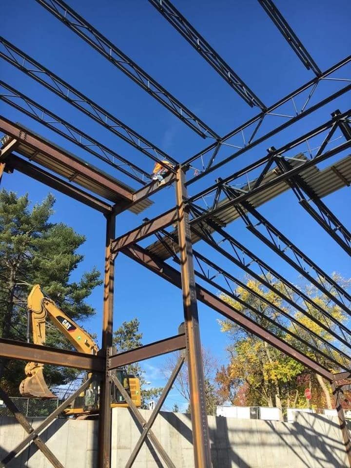 A large metal structure with a blue sky in the background