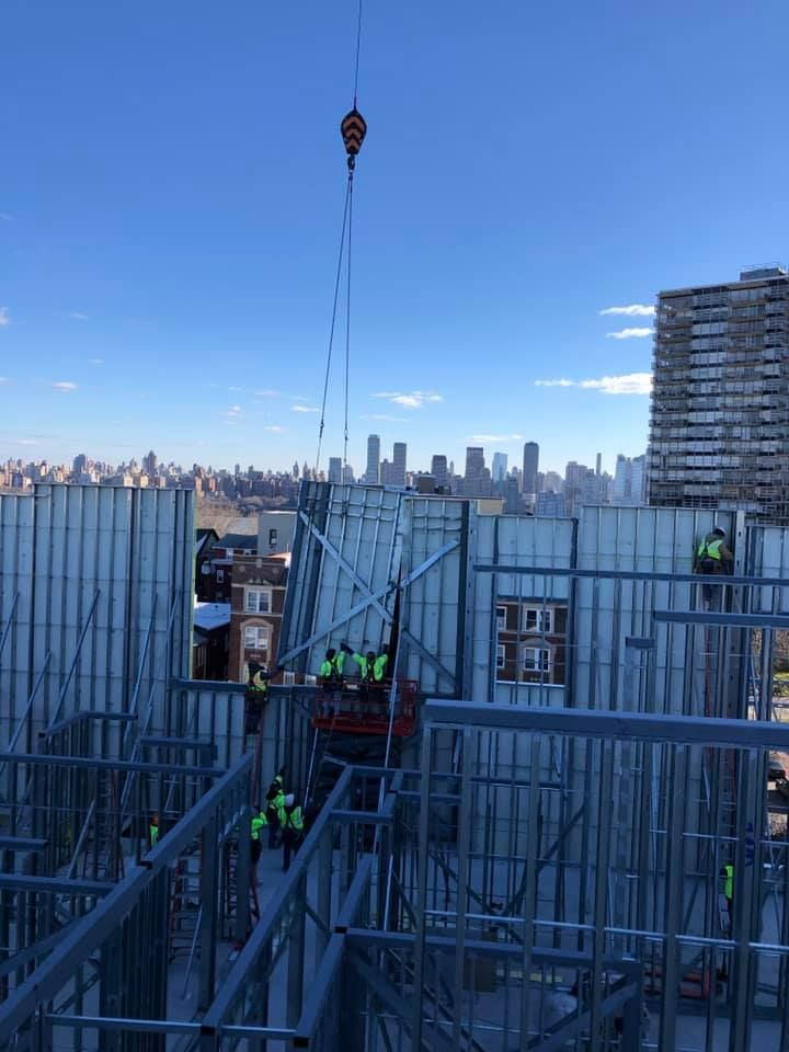 A group of construction workers are working on a building