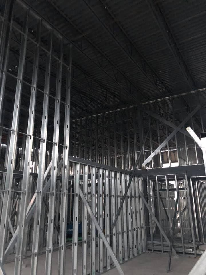 A building under construction with a lot of metal frames